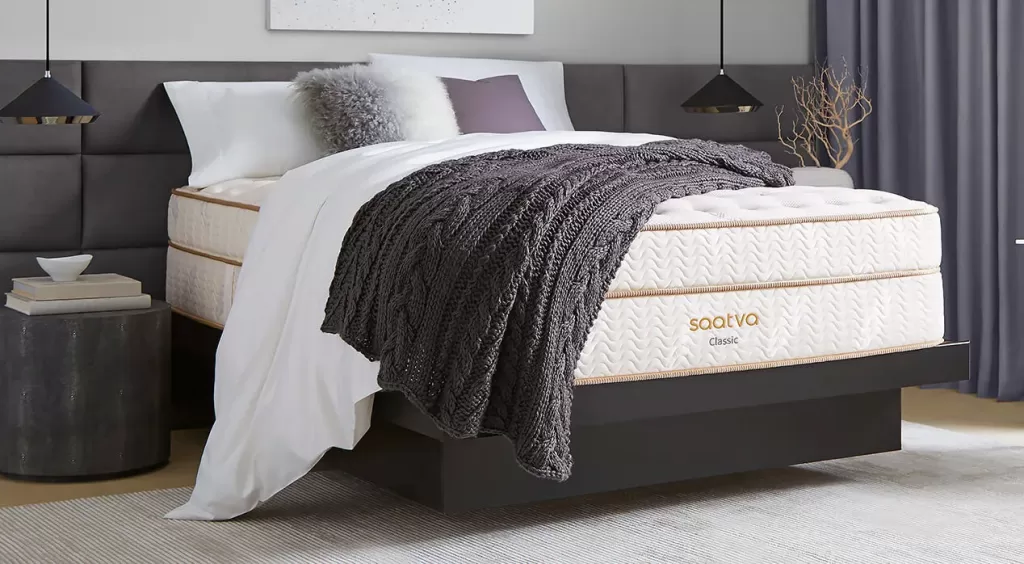 Saatva Classic mattress styled in a modern bedroom.